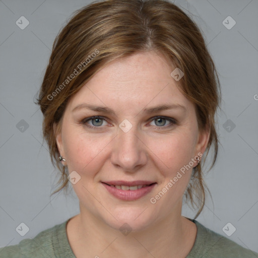 Joyful white young-adult female with medium  brown hair and blue eyes