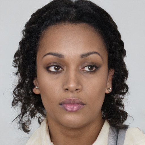Neutral black young-adult female with long  black hair and brown eyes