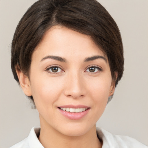 Joyful white young-adult female with short  brown hair and brown eyes