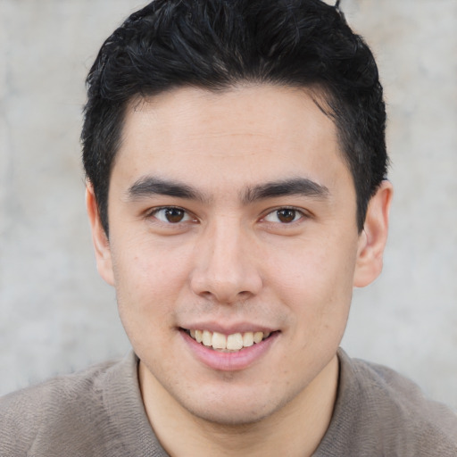 Joyful latino young-adult male with short  brown hair and brown eyes