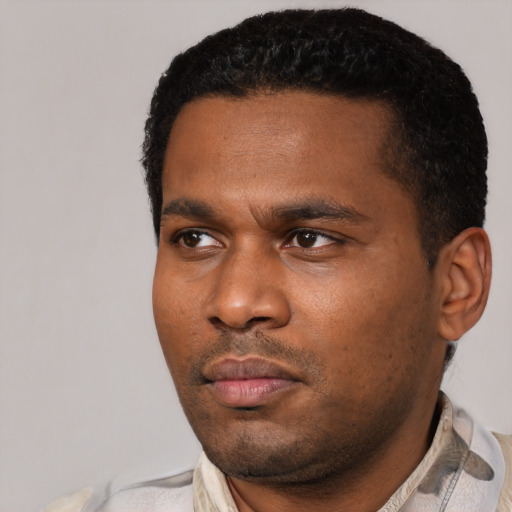 Neutral black young-adult male with short  black hair and brown eyes