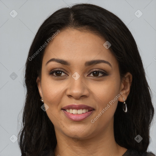 Joyful latino young-adult female with long  brown hair and brown eyes