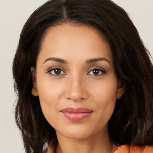 Joyful white young-adult female with long  brown hair and brown eyes