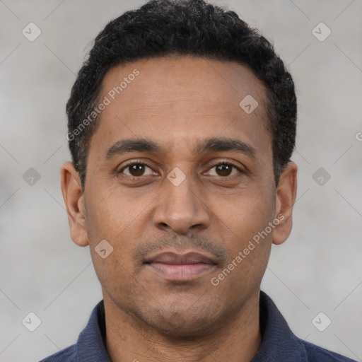Neutral latino adult male with short  black hair and brown eyes