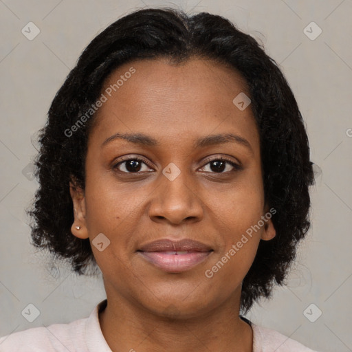 Joyful black young-adult female with medium  brown hair and brown eyes