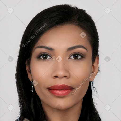 Joyful latino young-adult female with long  black hair and brown eyes