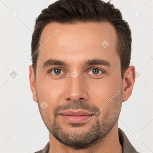 Joyful white young-adult male with short  brown hair and brown eyes