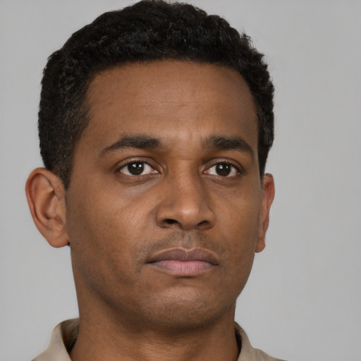 Neutral black young-adult male with short  brown hair and brown eyes