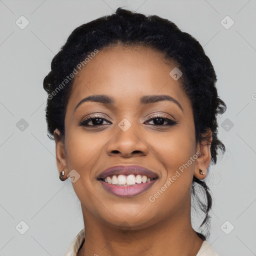 Joyful latino young-adult female with long  black hair and brown eyes