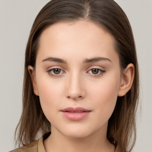 Neutral white young-adult female with long  brown hair and brown eyes