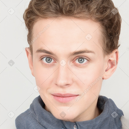 Joyful white young-adult female with short  brown hair and blue eyes