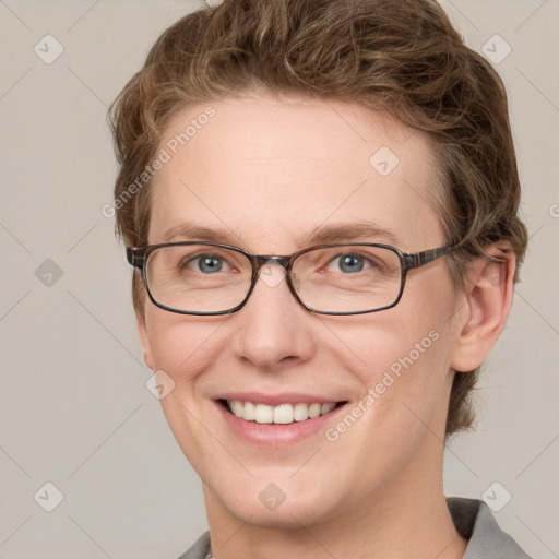 Joyful white adult female with short  brown hair and grey eyes