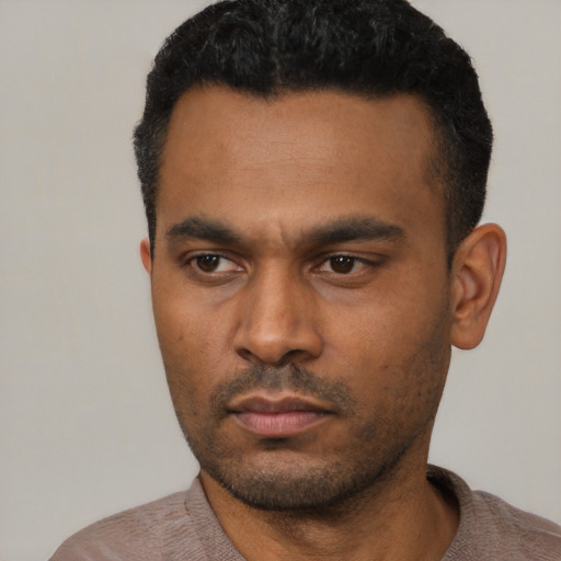 Neutral latino young-adult male with short  black hair and brown eyes
