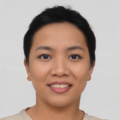 Joyful asian young-adult female with short  black hair and brown eyes