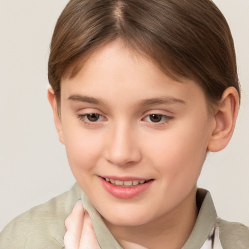 Joyful white child female with short  brown hair and brown eyes