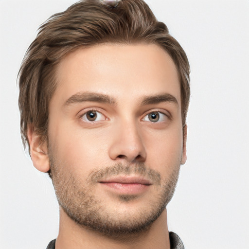 Joyful white young-adult male with short  brown hair and grey eyes