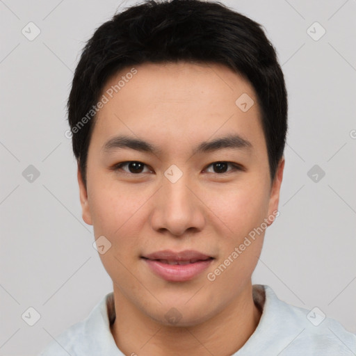 Joyful asian young-adult male with short  black hair and brown eyes