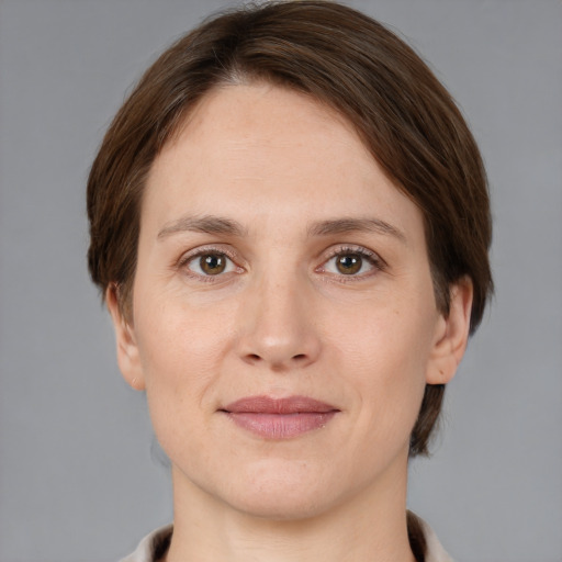 Joyful white young-adult female with medium  brown hair and grey eyes