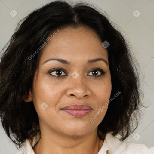 Joyful latino adult female with medium  brown hair and brown eyes