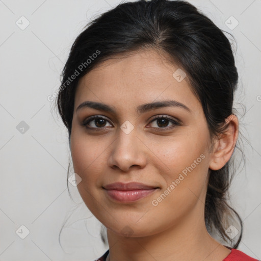 Joyful latino young-adult female with medium  brown hair and brown eyes