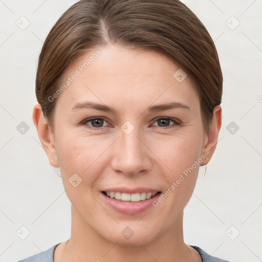 Joyful white young-adult female with short  brown hair and grey eyes