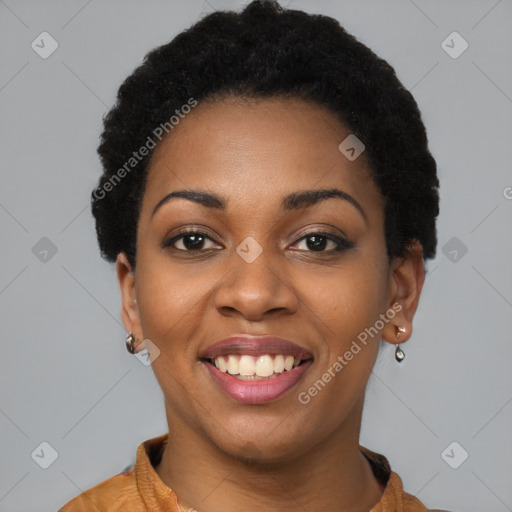 Joyful black young-adult female with short  black hair and brown eyes