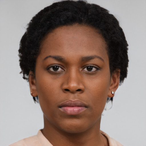 Neutral black young-adult female with short  brown hair and brown eyes