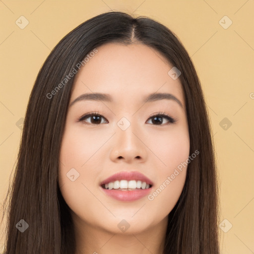 Joyful asian young-adult female with long  brown hair and brown eyes