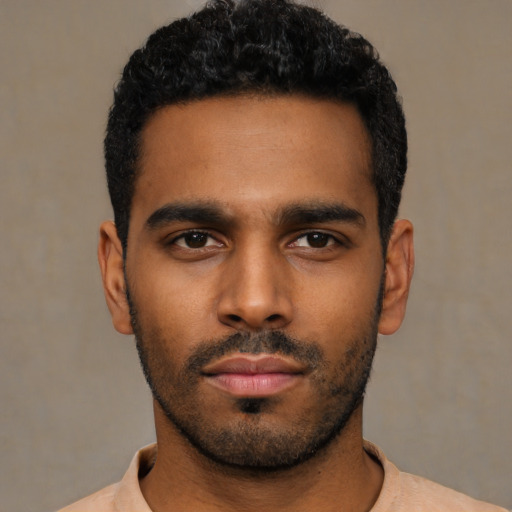 Neutral latino young-adult male with short  black hair and brown eyes