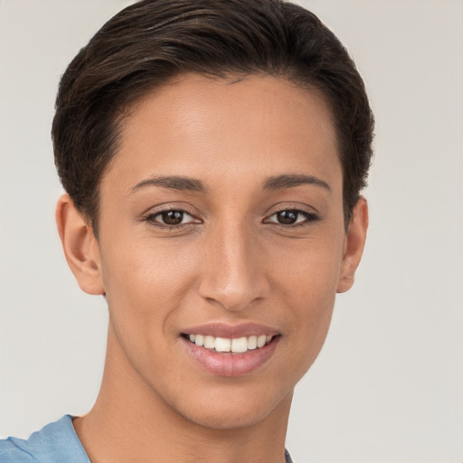 Joyful white young-adult female with short  brown hair and brown eyes