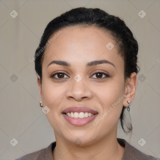 Joyful latino young-adult female with medium  brown hair and brown eyes