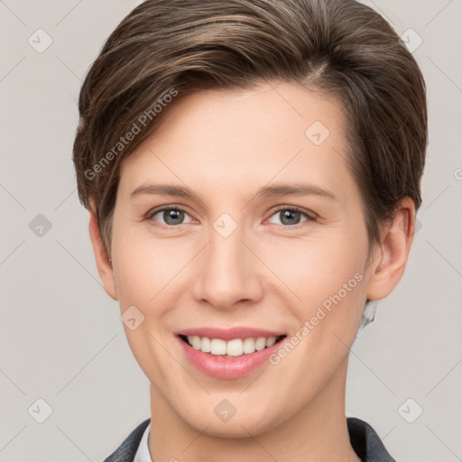 Joyful white young-adult female with short  brown hair and grey eyes