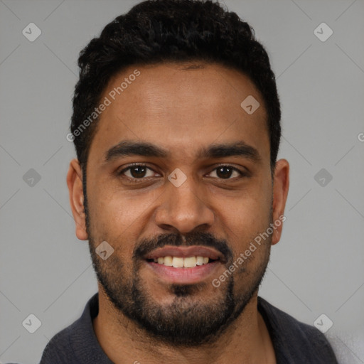 Joyful black young-adult male with short  black hair and brown eyes