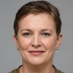 Joyful white adult female with short  brown hair and grey eyes