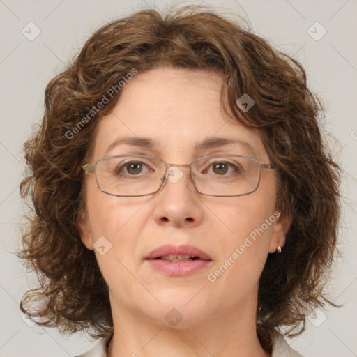 Joyful white adult female with medium  brown hair and green eyes