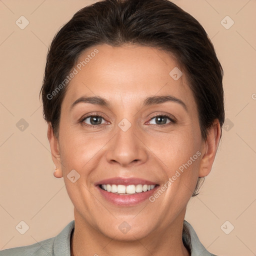 Joyful white adult female with short  brown hair and brown eyes