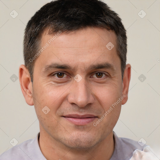 Joyful white adult male with short  brown hair and brown eyes