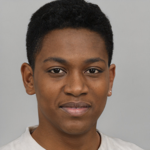 Joyful black young-adult male with short  brown hair and brown eyes