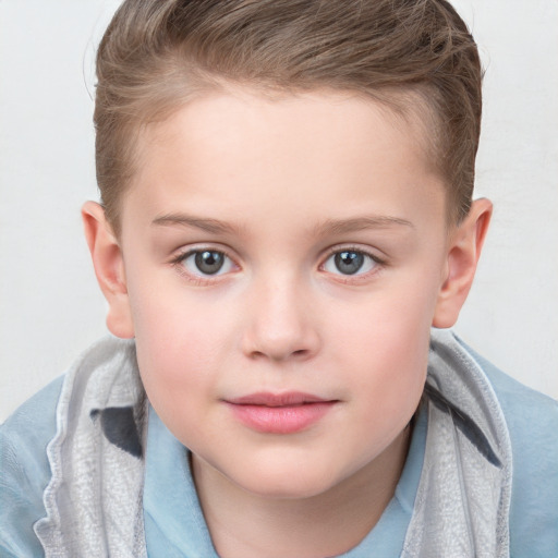 Joyful white child female with short  brown hair and blue eyes