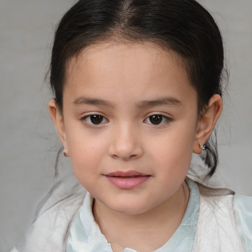 Joyful white child female with medium  brown hair and brown eyes