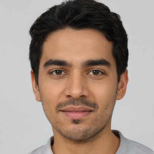Neutral latino young-adult male with short  black hair and brown eyes