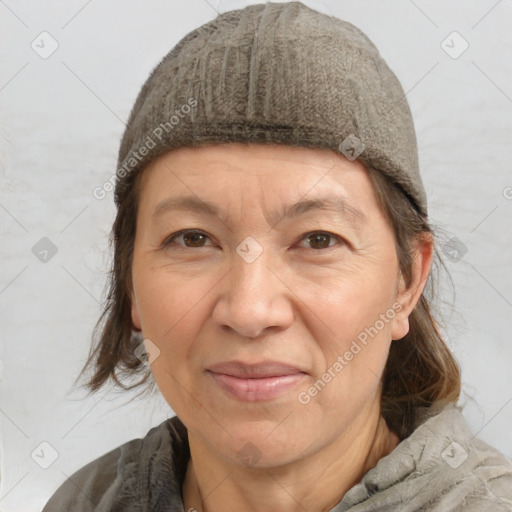 Joyful white adult female with medium  brown hair and brown eyes