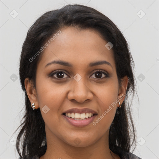 Joyful latino young-adult female with long  brown hair and brown eyes