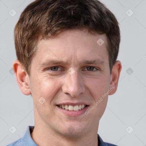 Joyful white adult male with short  brown hair and grey eyes