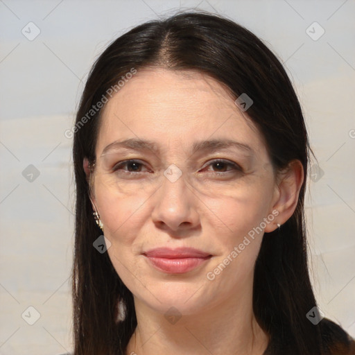 Joyful white adult female with long  brown hair and brown eyes