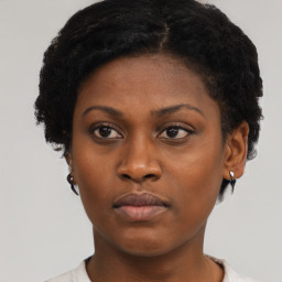 Neutral black young-adult female with short  brown hair and brown eyes