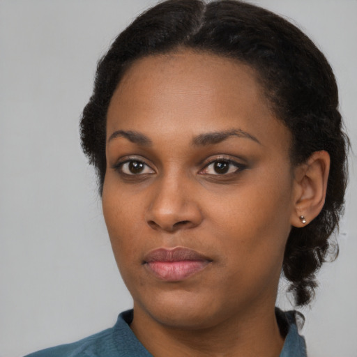 Neutral black young-adult female with long  black hair and brown eyes