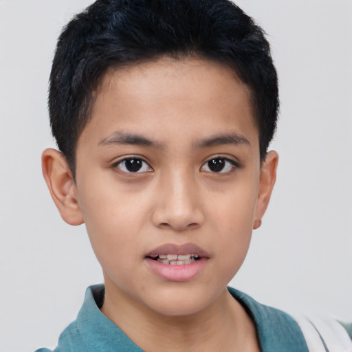 Joyful asian child male with short  brown hair and brown eyes
