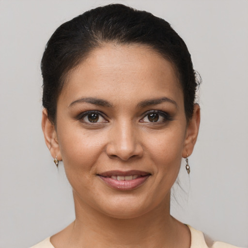 Joyful latino young-adult female with short  brown hair and brown eyes