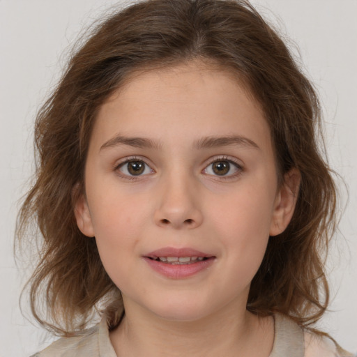 Joyful white child female with medium  brown hair and brown eyes